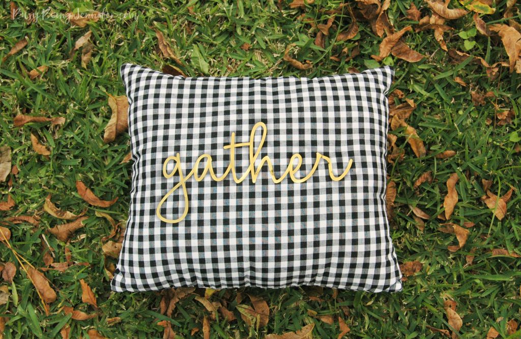 How cute is this Plaid and Gold Gather Pillow? It whips up in less than 30 minutes (depending on your sewing skill level) and is made with a pre-cut gold foil vinyl "gather" you just iron on! 
