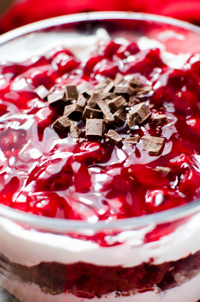The layers of cake, whipped cream, Cherry pie filling, chocolate and just a hint of cherry liquor, combine into heavenly bites of decadent Red Velvet Cherry Trifle that DOES NOT DISAPPOINT!