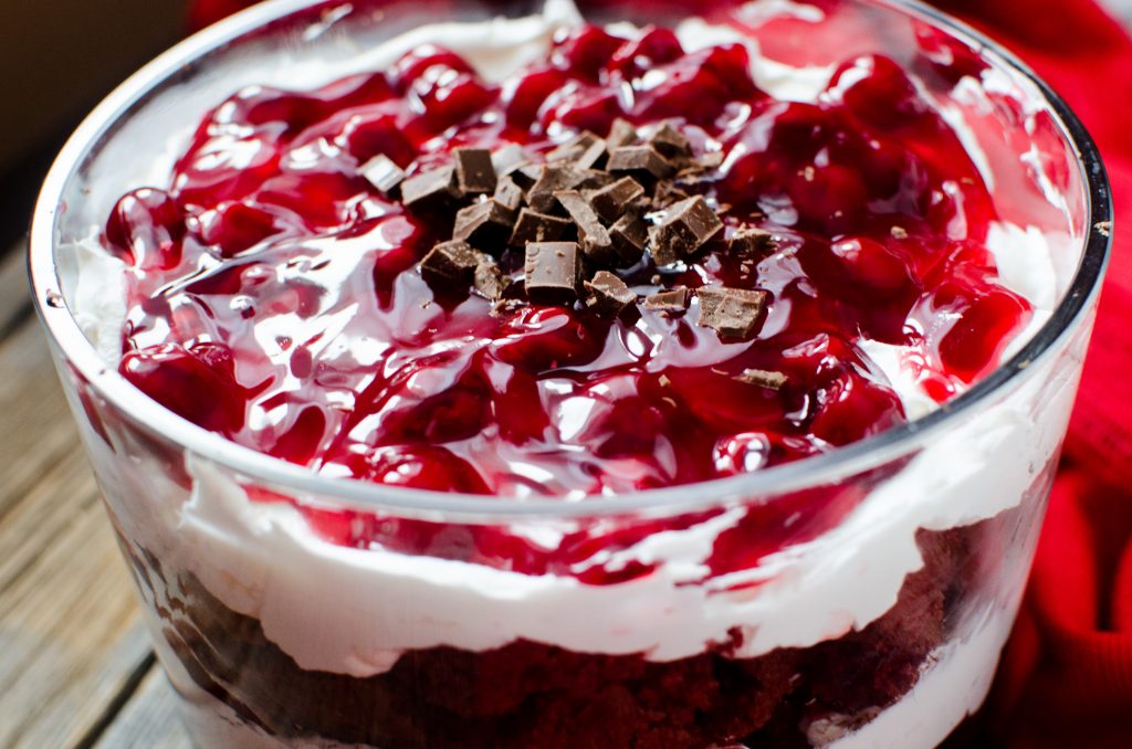 The layers of cake, whipped cream, Cherry pie filling, chocolate and just a hint of cherry liquor, combine into heavenly bites of decadent Red Velvet Cherry Trifle that DOES NOT DISAPPOINT!