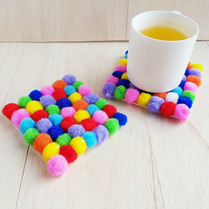 With just a few supplies from around the house you can make these sweet DIY pom pom coasters. They're perfect for gifting