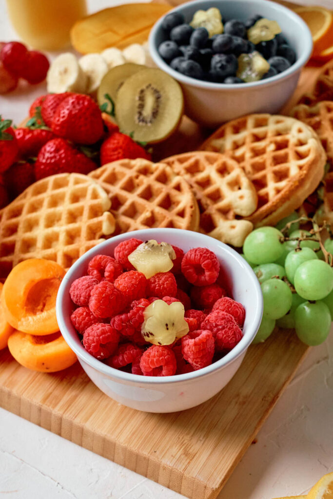 Learn how to make a breakfast waffle charcuterie board with homemade waffles with this easy grazing board set up!
